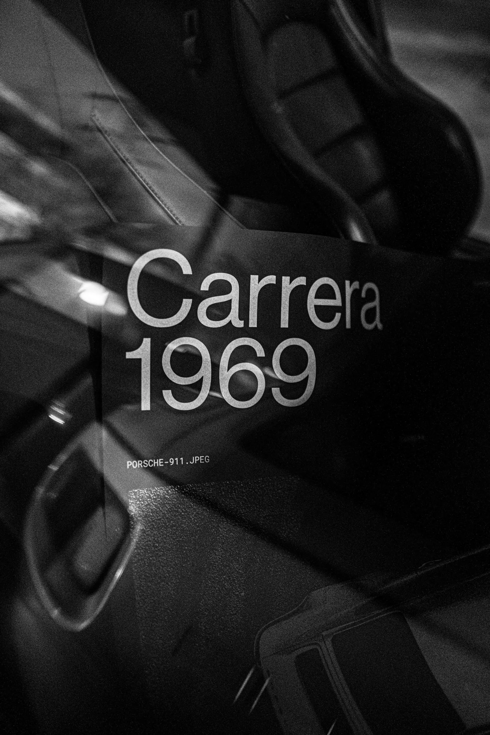 Black-and-white close-up of the Carrera 1969 lettering on the poster